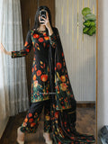 Model wearing a black suit with orange tulips – digital printed silk 3-piece suit