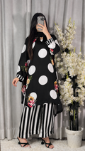 Model wearing a black kurta with large white polka dots and striped trousers – digital printed silk 3-piece suit