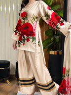 Model wearing a cream kurta with red roses and black-trim palazzo trousers – digital printed silk 3-piece suit