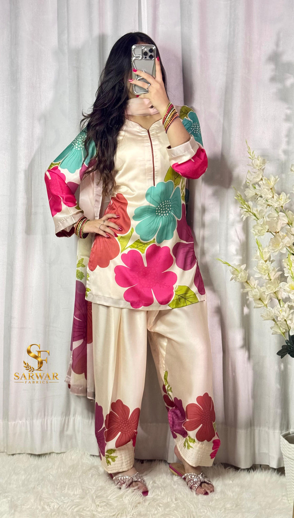 Model wearing a cream suit with large pink and red flowers – digital printed silk 3-piece suit