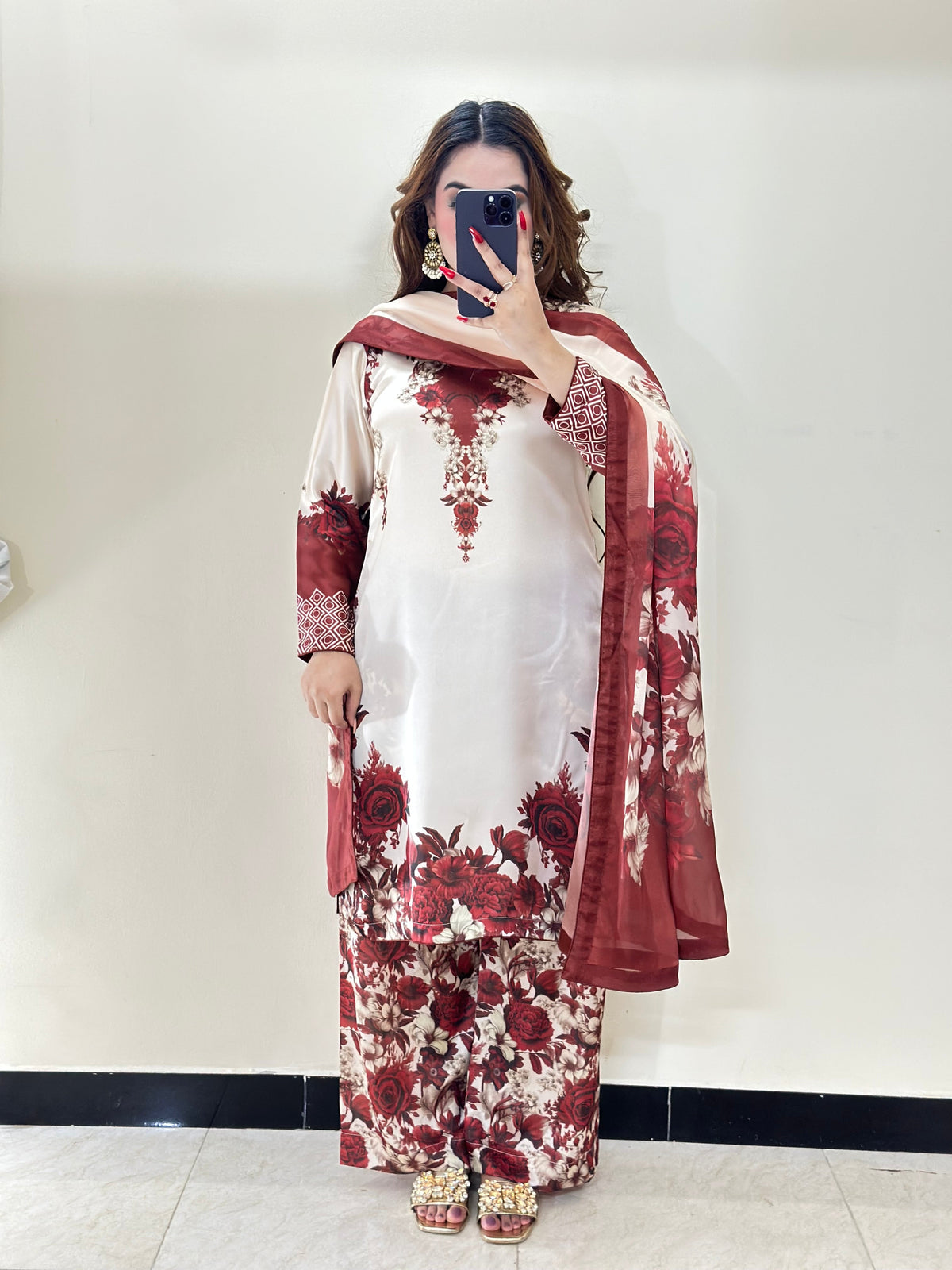 Model wearing a cream kurta with maroon-red florals and a maroon dupatta – digital printed silk 3-piece suit