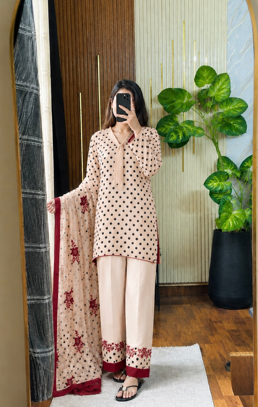 Model wearing a cream suit with maroon polka dots and a printed dupatta – digital printed silk 3-piece suit