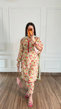 Model wearing a cream floral print kurta with matching trousers and dupatta – Swiss lawn 3-piece suit