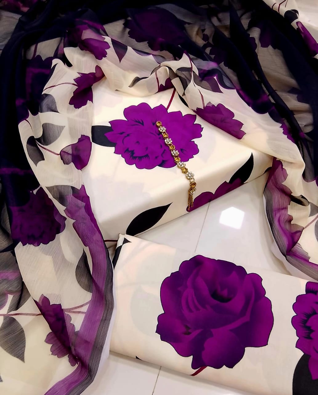 Unstitched Swiss lawn 3-piece suit in cream with large purple roses and a black sheer dupatta