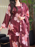 Model wearing a maroon suit with large pink flowers – digital printed silk 3-piece suit