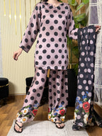 Model wearing a mauve black polka-dot kurta with floral-hem trousers – digital printed silk 3-piece suit
