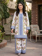 Kashi ivory blue tile print shirt and wide-leg trouser worn outdoors - Zarafshan