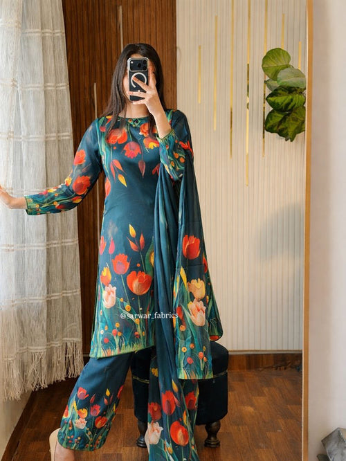 Model wearing a teal suit with a tulip print – digital printed silk 3-piece suit