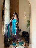 Model wearing a teal kurta with dark floral print trousers and dupatta – digital printed silk 3-piece suit